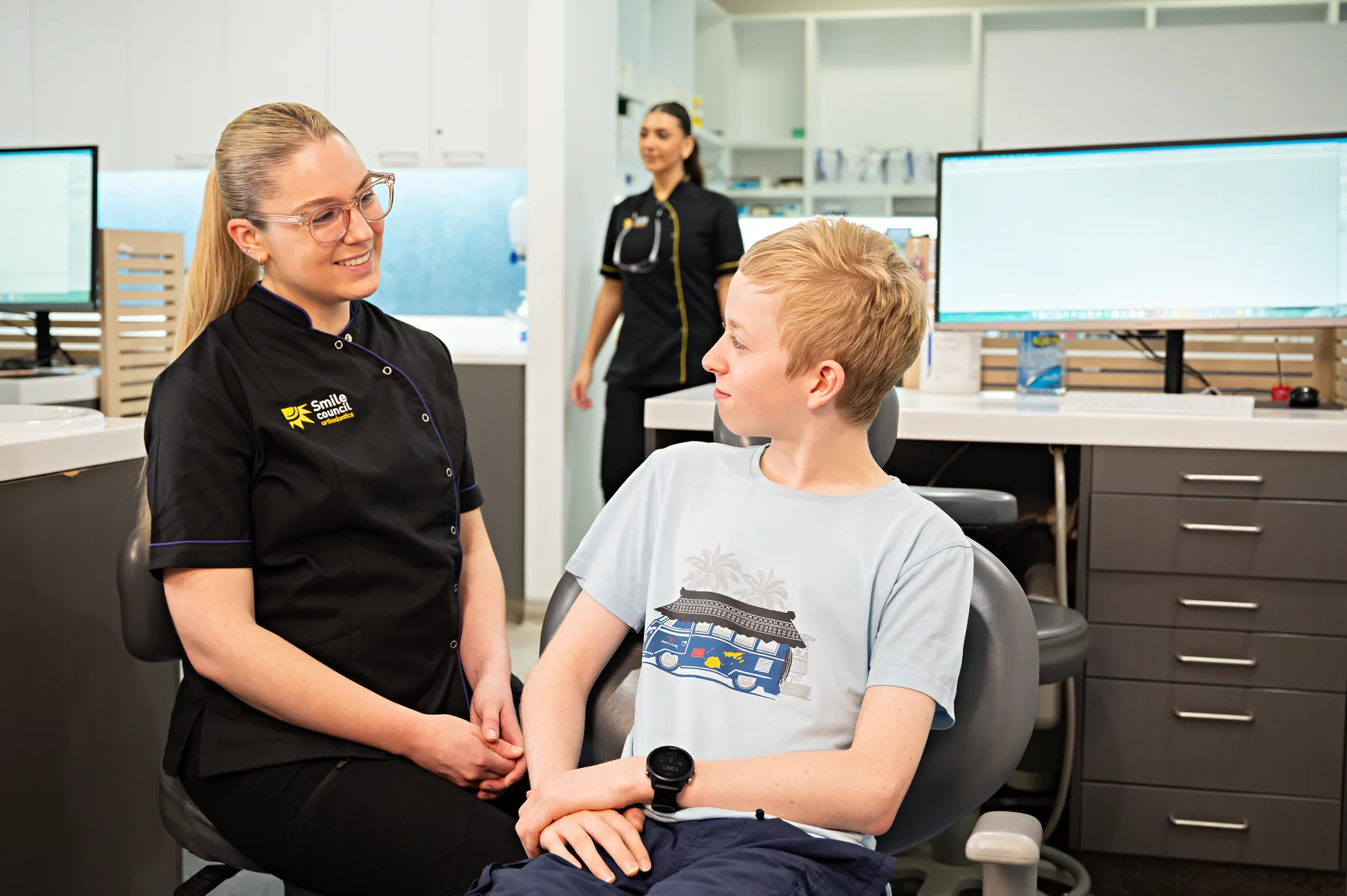 A patient speaking with a Smile Council team member